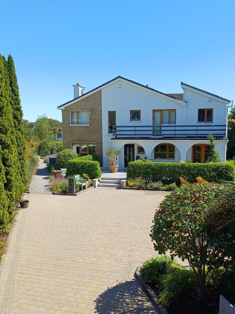House and paved driveway in Cork after a Gold Standard Full House Softwash