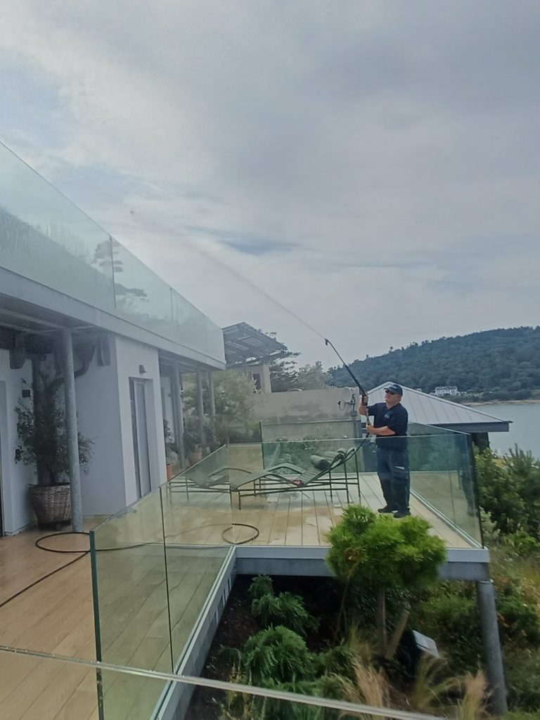 Softwashing a house terrace and glass balcony in Cork