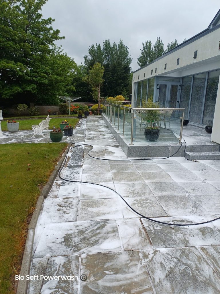 Patio being cleaned as part of a Gold Standard Full House Softwash